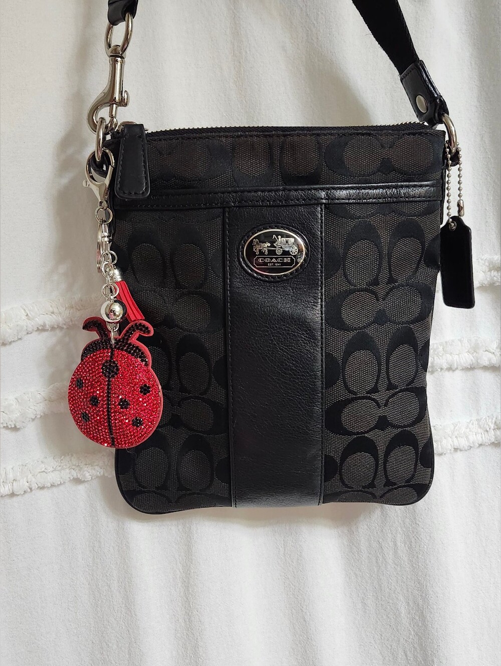 Coach Sutton Black/Brown Signature Canvas/Leather Crossbody Bag.